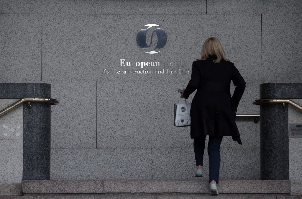 A visitor enters One Exchange Square, the headquarters of the European Bank for Reconstruction and Development (EBRD), in London, U.K., on Monday, May 21, 2012. Shareholders of the European Bank for Reconstruction and Development approved 1 billion euros of funding for the southern- and eastern Mediterranean region where it's expanding its investments to support emerging democracies. Photographer: Simon Dawson/Bloomberg via Getty Images