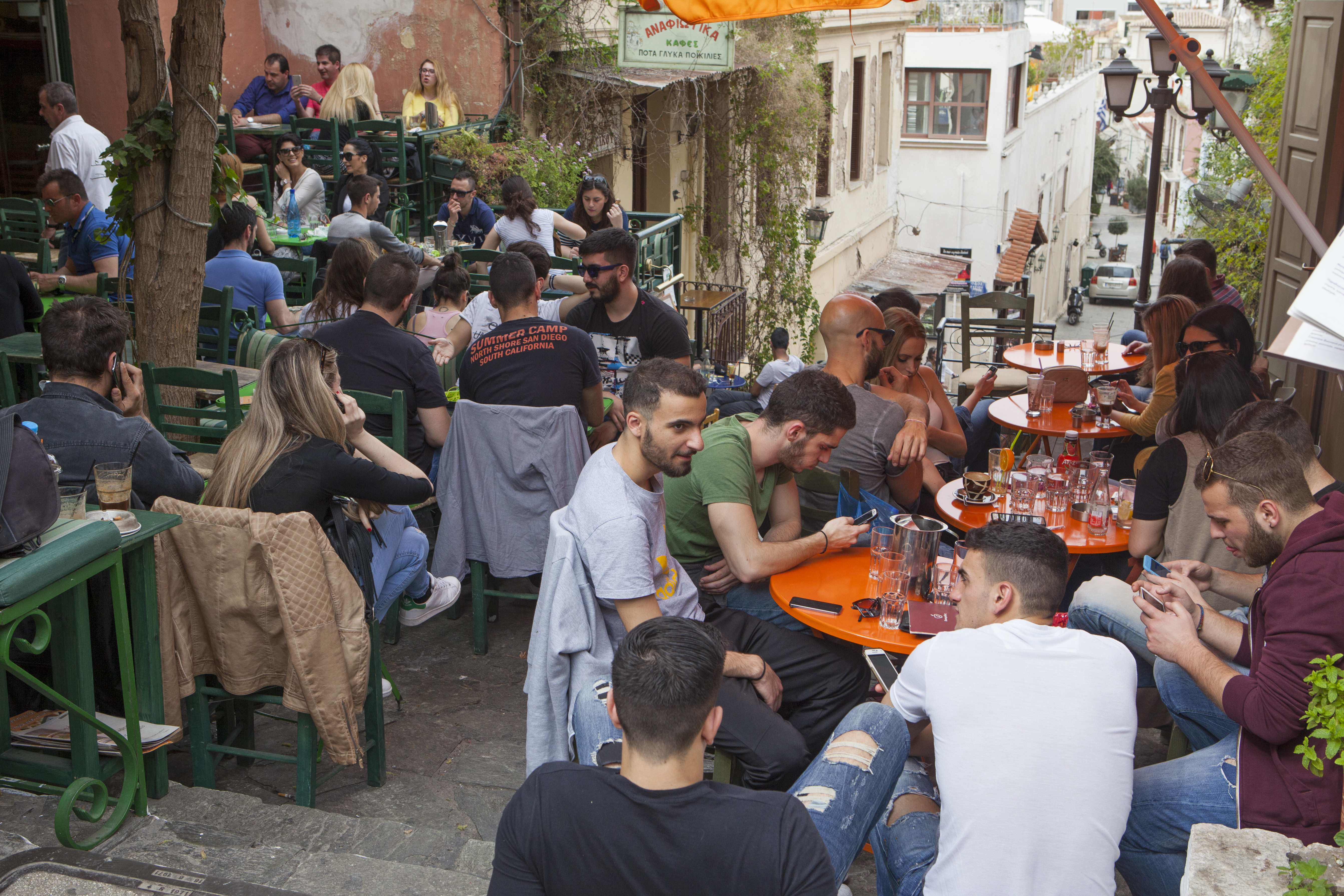 ATHENS, GREECE - APRIL 7: People enjoy an outdoor cafe in the Plaka neighborhood, on April 7, 2016 in Athens, Greece. As it recovers from the financial crisis, Athens is experiencing a cultural rebirth. This spring, the streets are filled with tourists. (Photo by Melanie Stetson Freeman/The Christian Science Monitor via Getty Images)