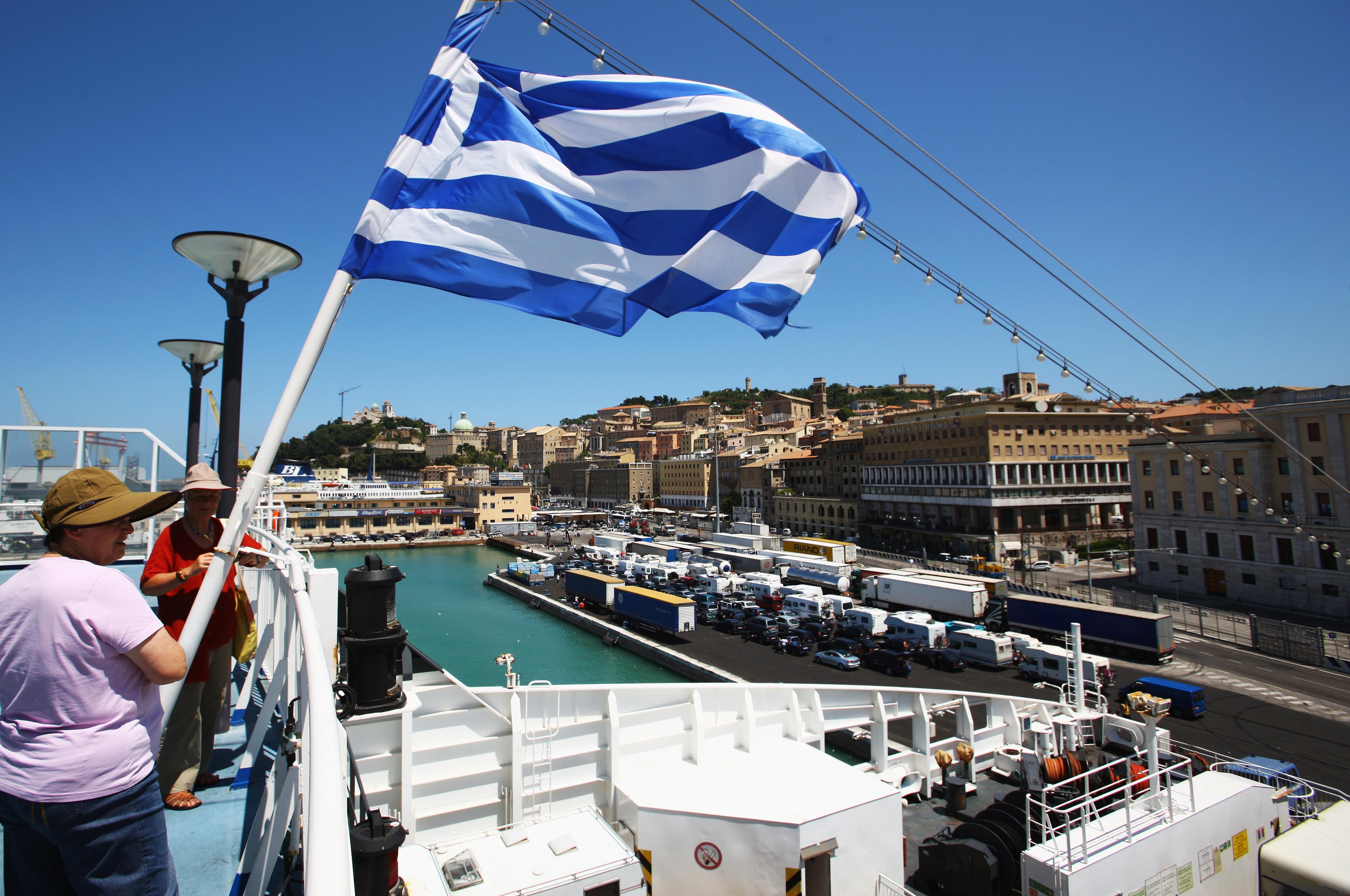 ANCONA, ITALY - JULY 09: Travelers with their cars and caravans wait for the ferry departure to Piraeus, Greece on July 8, 2008 in the harbour of Ancona, Italy.The harbour is the point of departure for many passengers on their way to holidays to south Europe and the east of the Adriatic Sea. (Photo by EyesWideOpen/Getty Images)