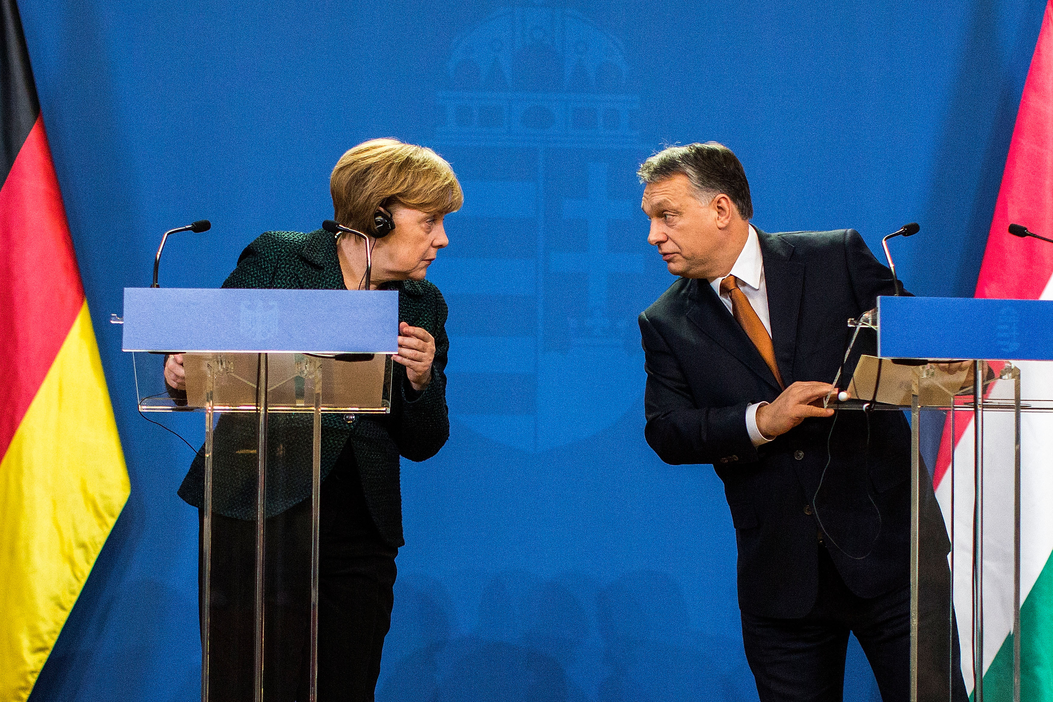 BUDAPEST, HUNGARY - FEBRUARY 02:  German Chancellor Angela Merkel (L) and Hungarian Prime Minister Viktor Orban (R) speak to each other following talks on February 2, 2015 in Budapest, Hungary. Merkel is on a one-day visit to the Hungarian capital in a trip that includes meetings with government leaders, discussions with students at Andrassy University and meetings with local Jewish leaders. Merkel's visit was preceded the day before by demonstrations against the Orban government.  (Photo by Carsten Koall/Getty Images)