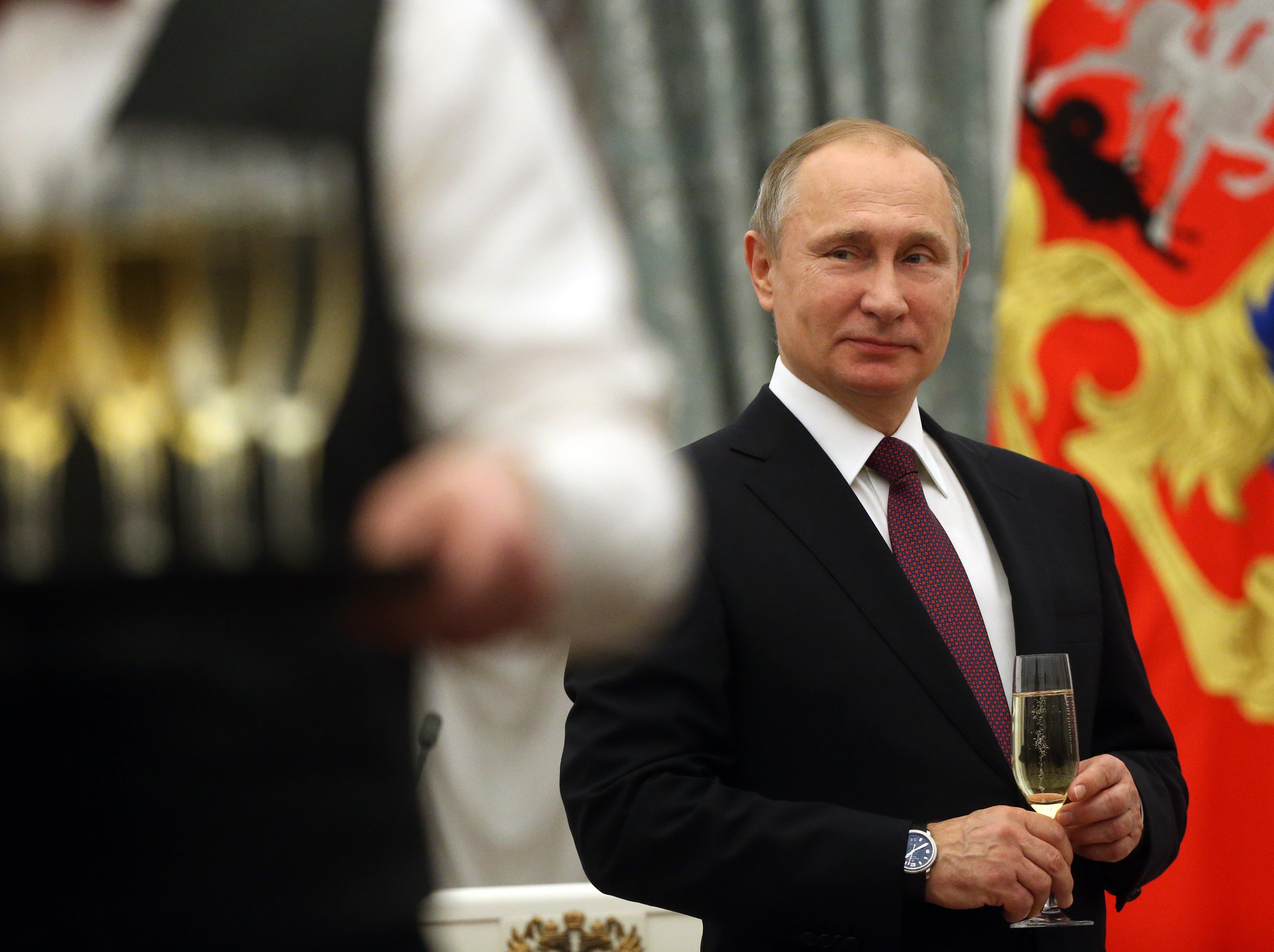 RUSSIA, MOSCOW - DECEMBER 8: (RUSSIA OUT) Russian President Vladimir Putin holds a glass of champagne during the awarding ceremony for Human Rights and Civil Society activists at the Grand Kremlin Palace on December, 8, 2016 in Moscow, Russia. (Photo by Mikhail Svetlov/Getty Images)